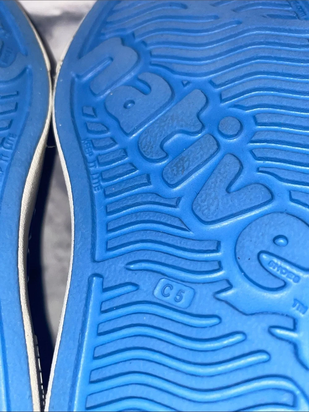 Native Jefferson Blue Slip-On with Neon Lightning Bolts. Size 5